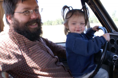 Daddy and little girl driving truck